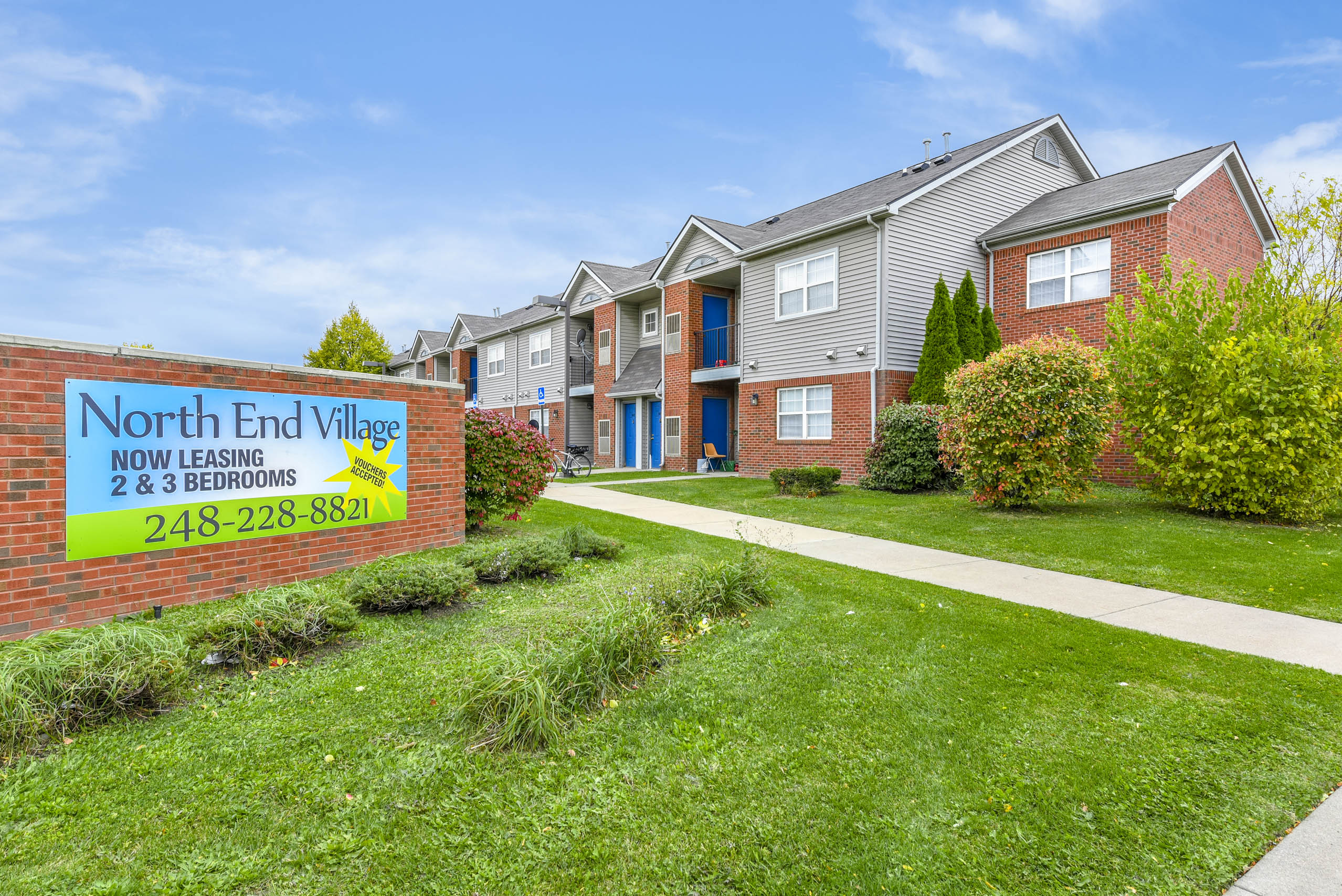 A sign for North End Village