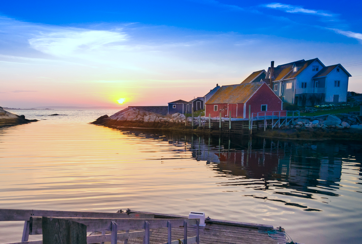 A quaint image of a Nova Scotian waterfront property at sunset.