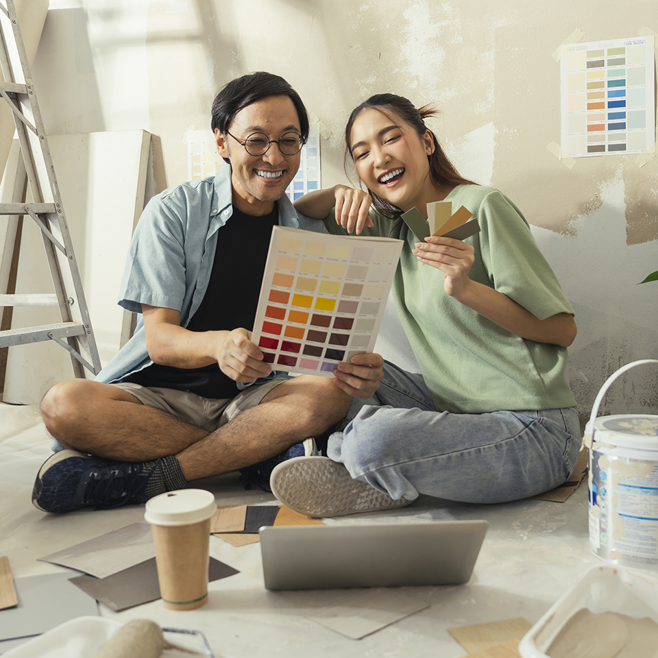 Two people looking at color swatches.