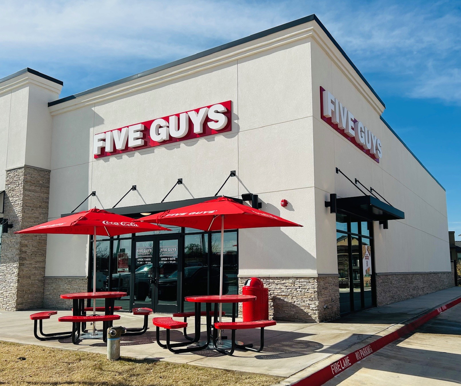 Exterior photograph of the Five Guys restaurant at 8633 Davis Boulevard in North Richland Hills, Texas.