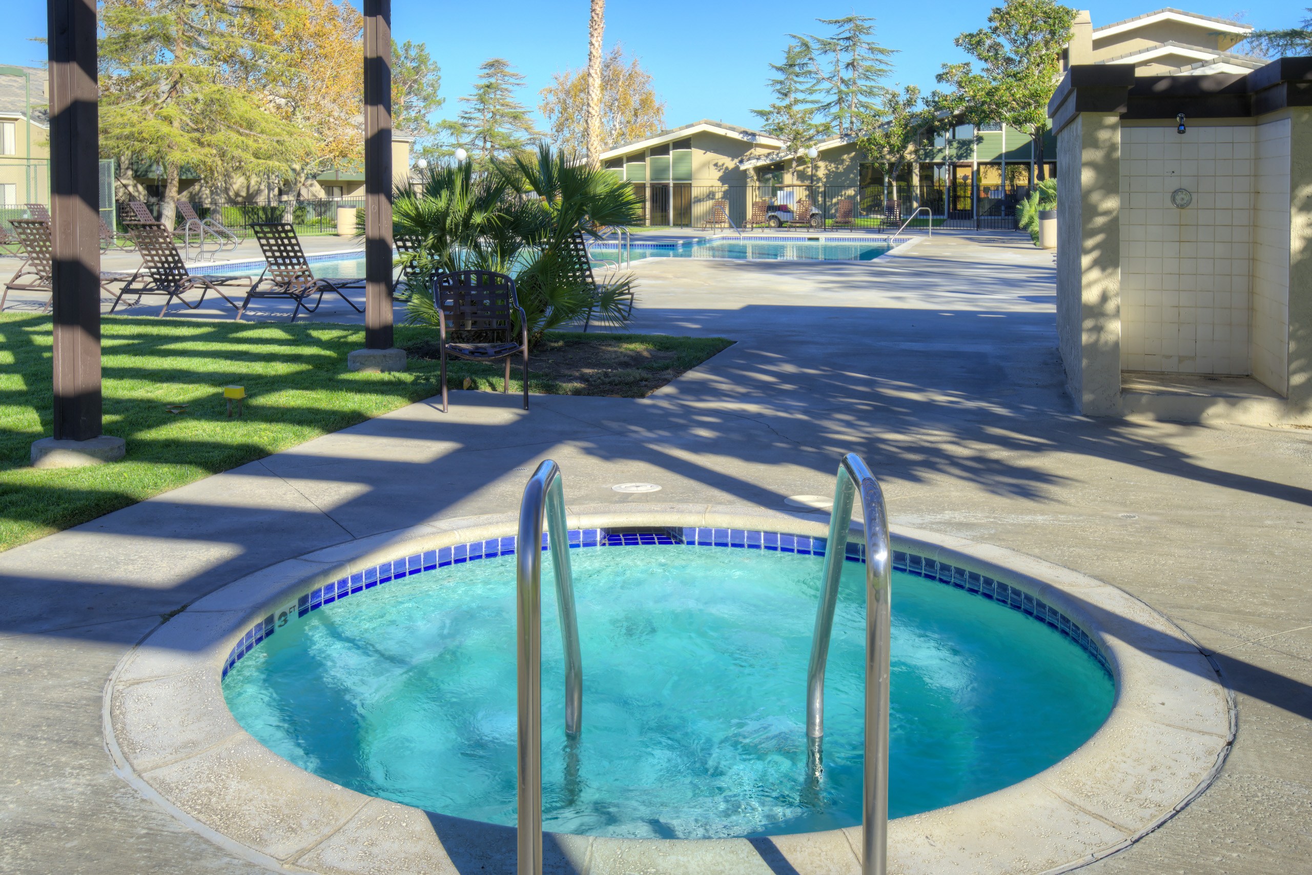 A small pool with a fountain in the middle.