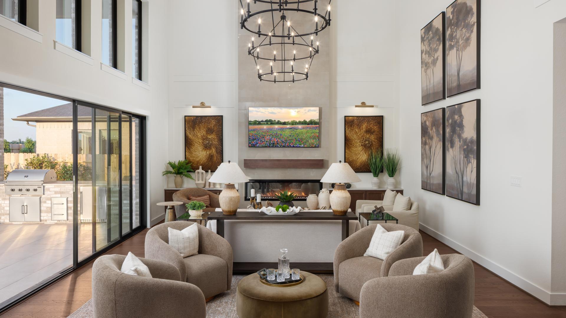 Grand windows and soaring ceilings create a bright, inviting space for large gatherings or quiet evenings