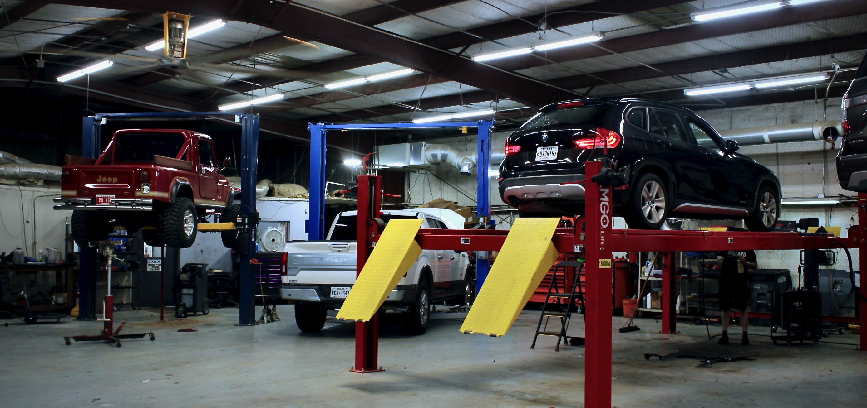 Vehicle lifts and service bays at Willard Automotive in Lewisville, TX. 