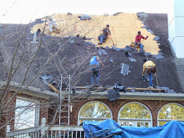 Workers Cleaning up the Roof