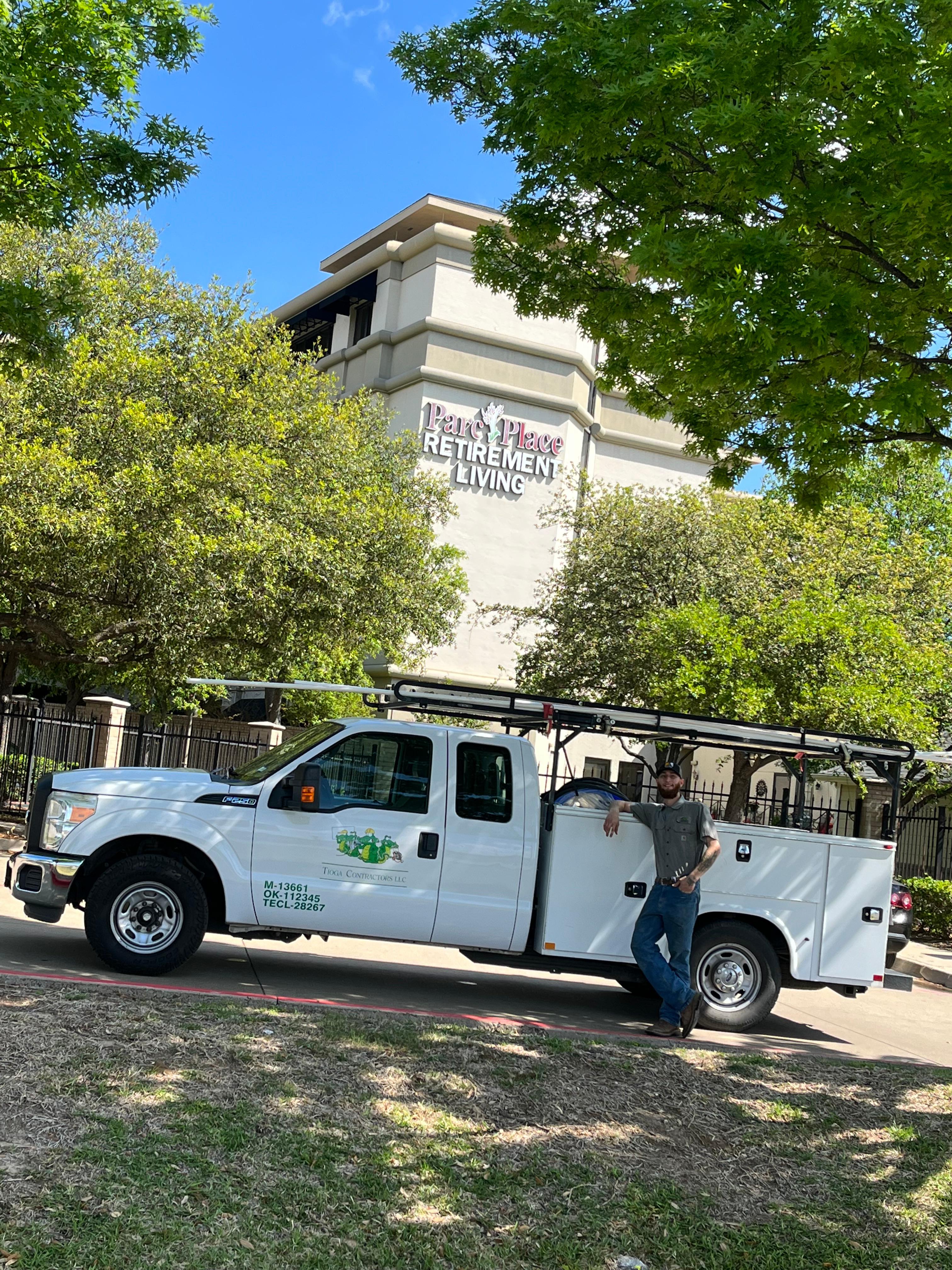 A Tioga service tech with his truck at Parc Place Retirement Living in Bedford Texas.