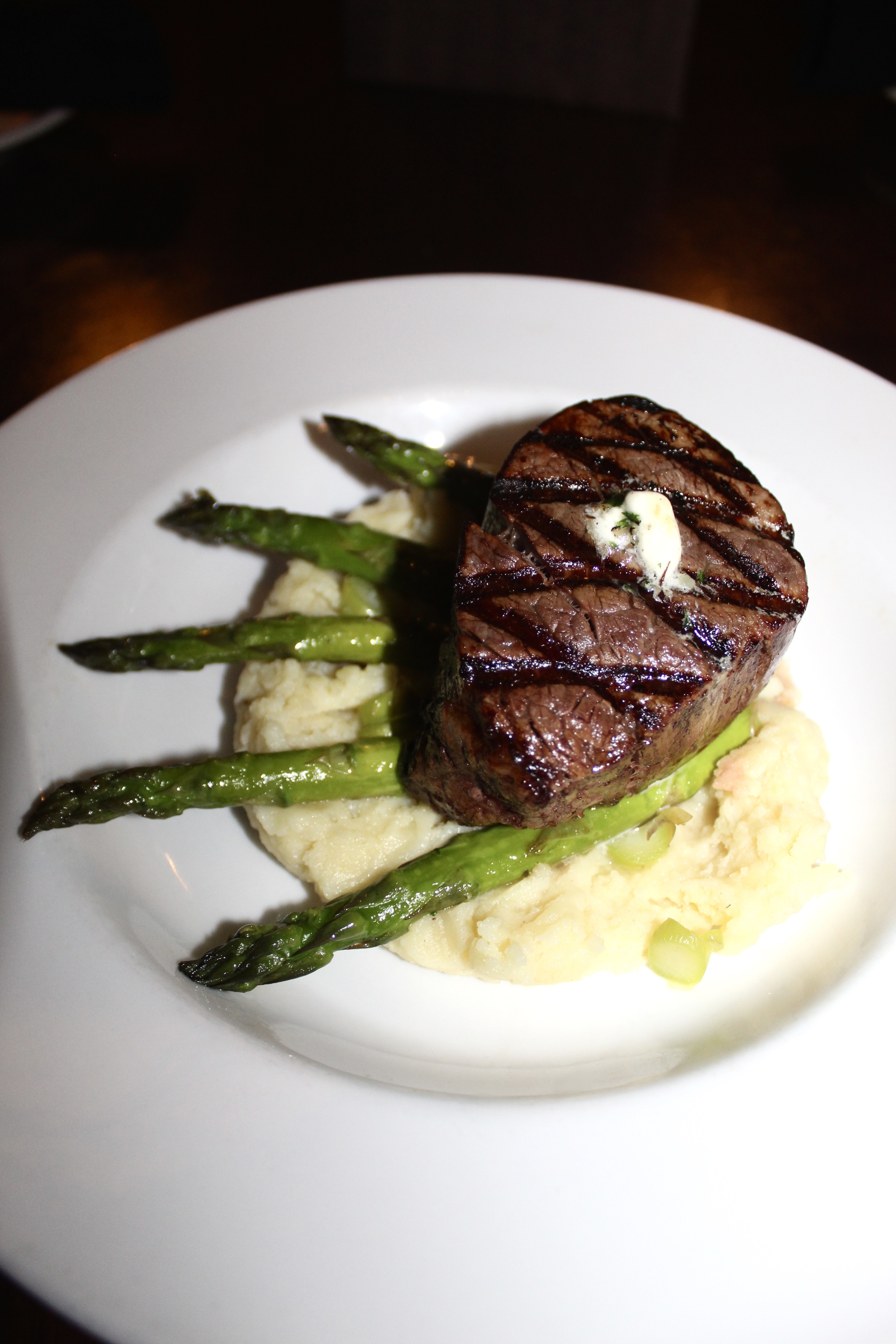 Mama's On The Half Shell Filet Mignon served with whipped potatoes & asparagus 