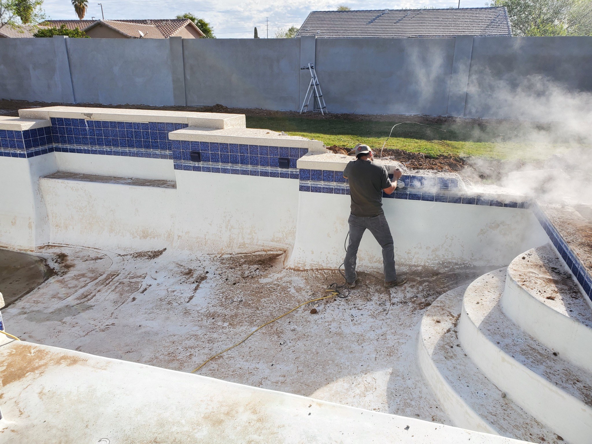 Successful pool remodeling starts with proper preparation. This photo captures an active stage of a  
