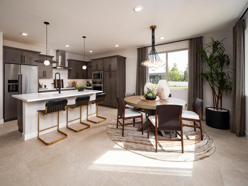 Beautiful kitchen with upgraded cabinets, cozy dining area, and island