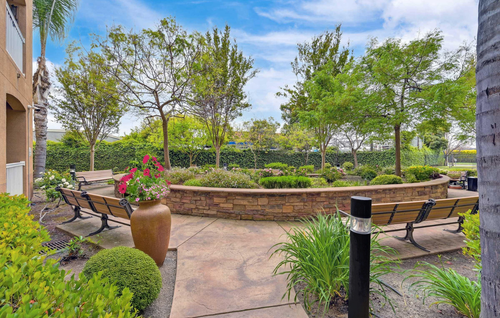 Garden Courtyard and Walking Paths at Hayward Village Senior Apartments in Hayward, CA