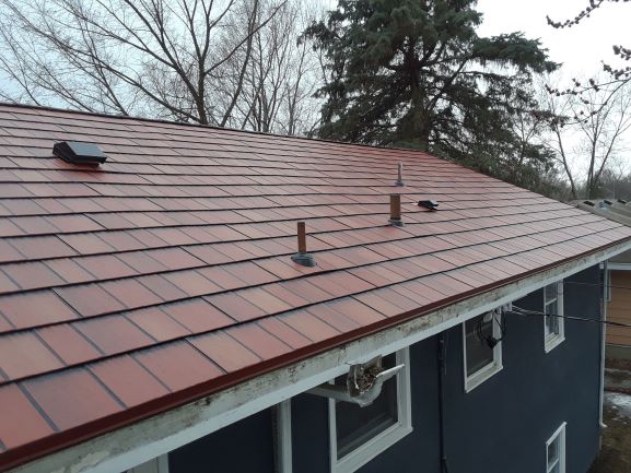 Steel roofing has many options. You can even combine two different styles of steel roofing to give your home or business the look you love. Pictured here is our painted steel and standing seam steel roofing options.