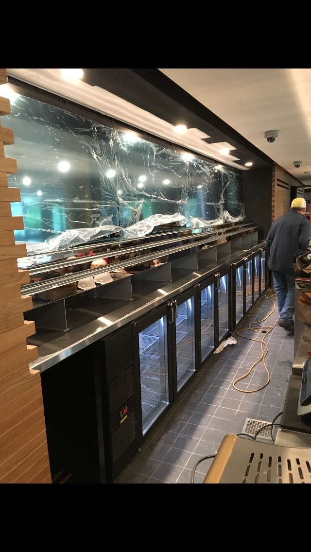 Recently completely project at the Watergate Hotel. 
- 14g Stainless Steel Counter Top
- Welded and mounted steel legs - post powder coating
- Custom fabricated liquor bottle shelving 
    - Made out of 12g Steel and then clad with 16g Mirror Polished Stainless Steel