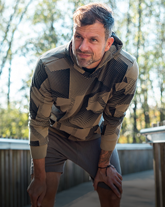 A man resting during outdoor exercise after GAE at American Access Care Physician, PLLC Brooklyn.