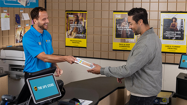 Associate assisting customer create a brochure