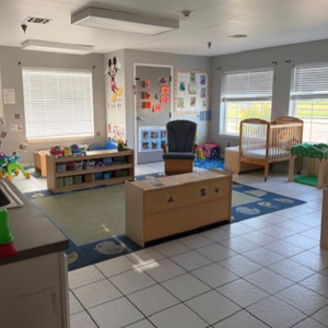 Bright and colorful preschool classroom at Childcare Network with age-appropriate learning materials 