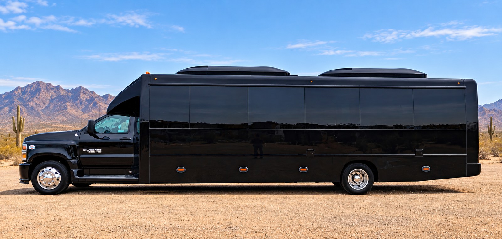 Side view of a long black group-transportation shuttle.