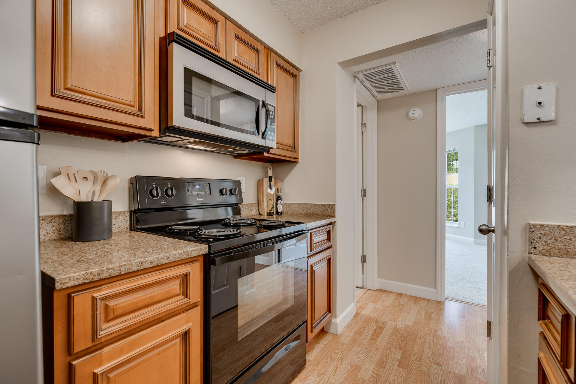 Kitchen With Stainless Steel Appliances & Granite Countertops