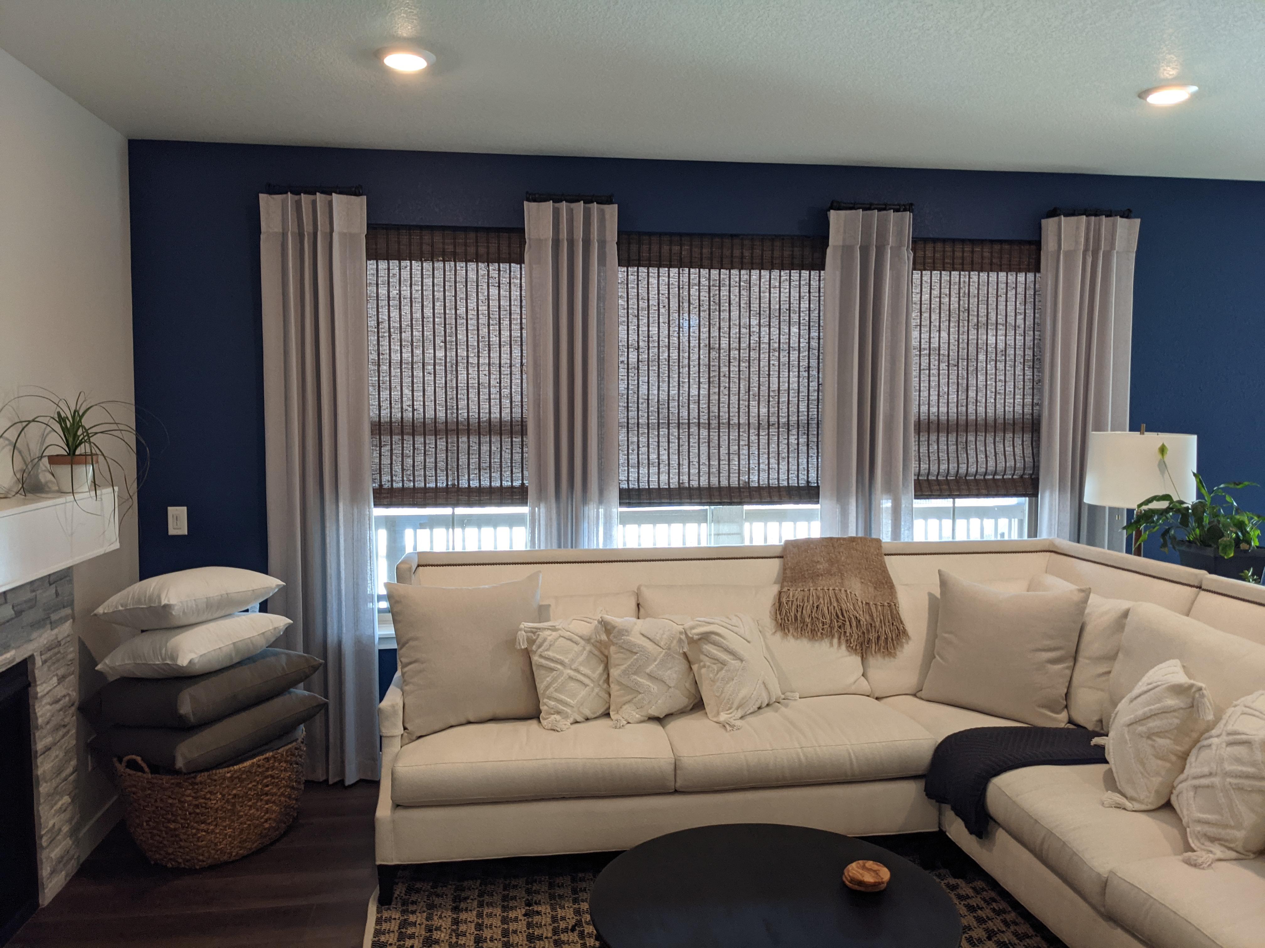 Drapery over Woven Wood Roman Shades in Littleton, a winning combination