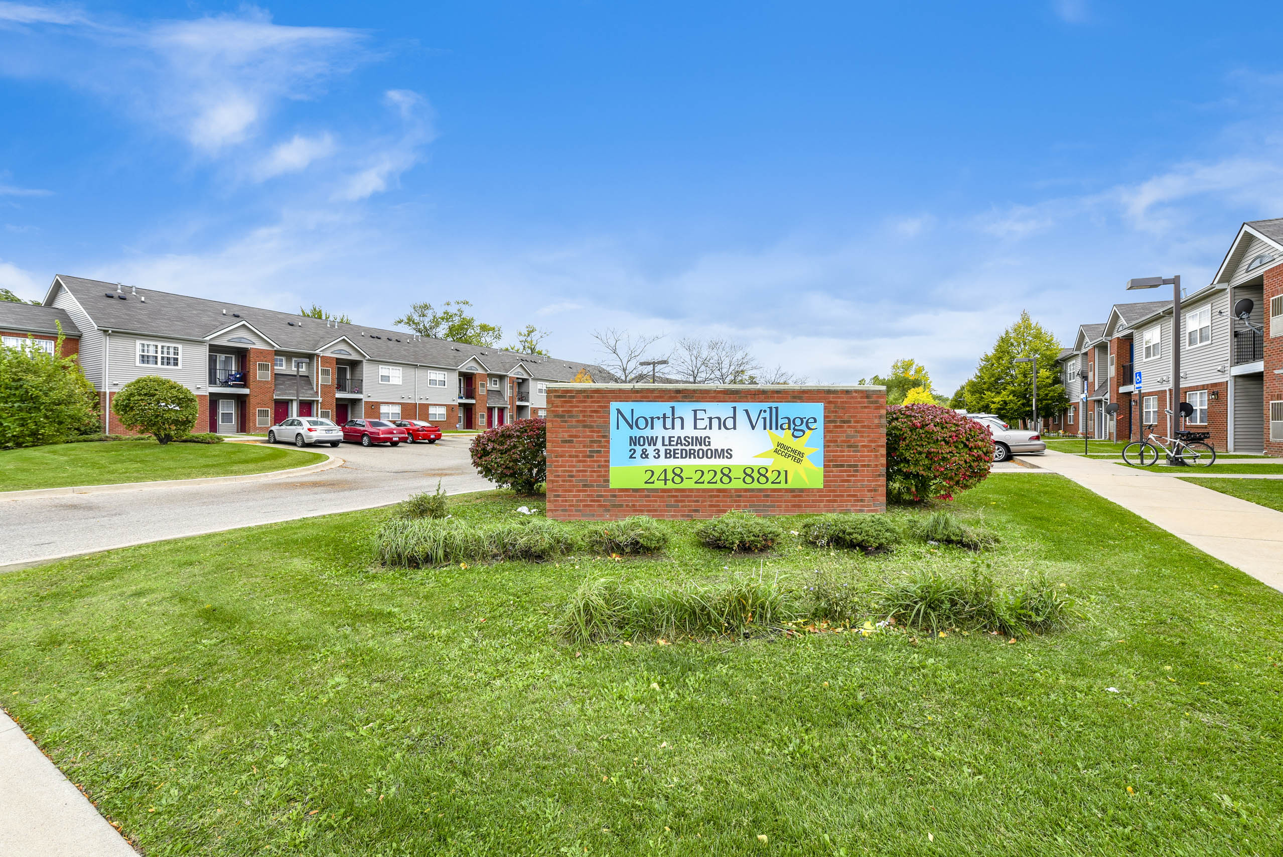 A sign for North End Village
