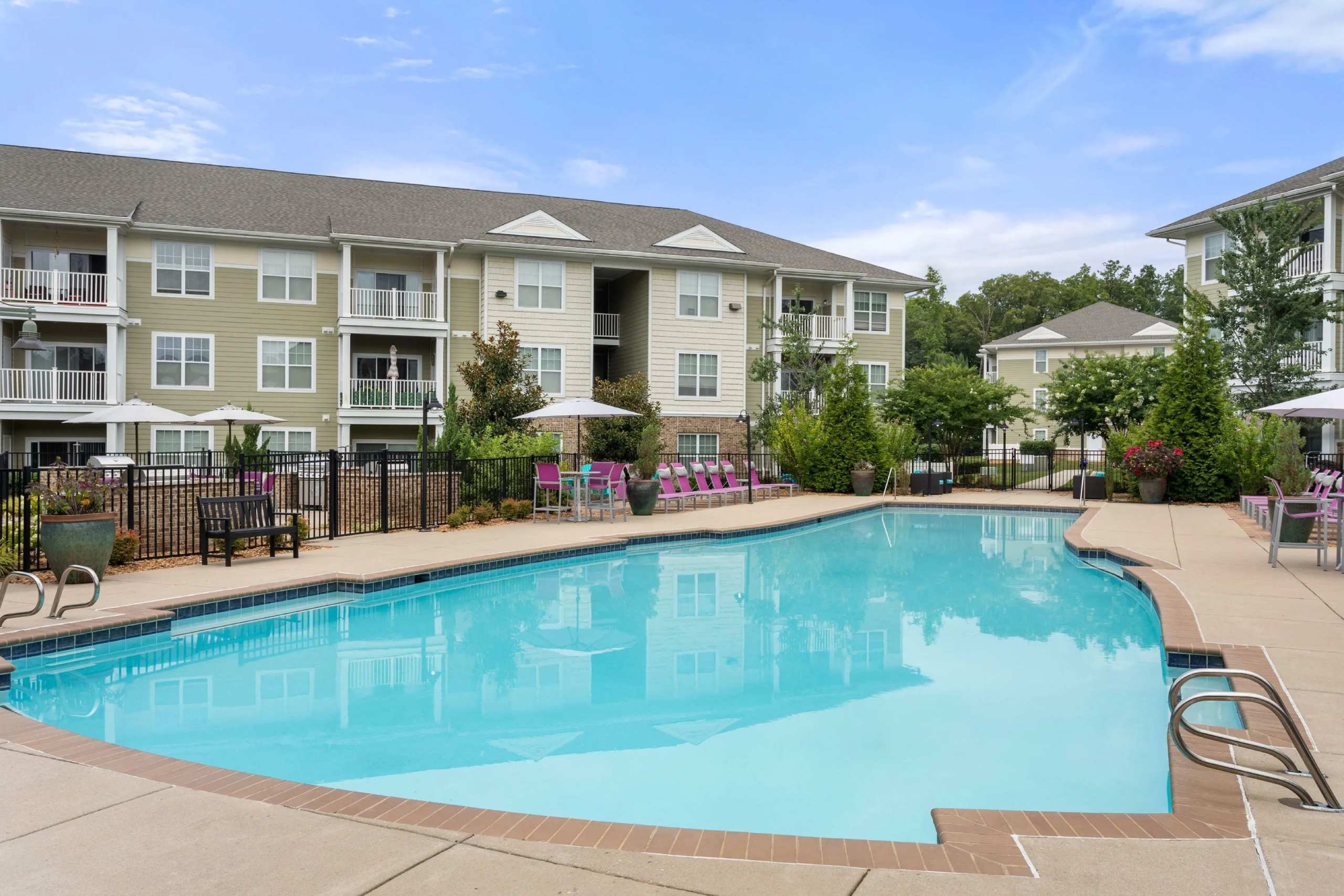 Resort style swimming pool with lounge seating