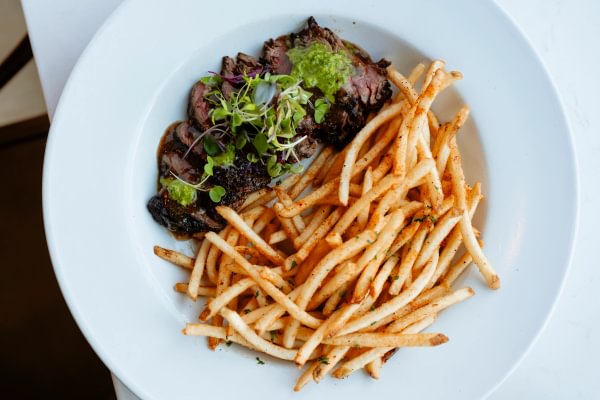 Hanger steak served medium, with bordelaise and schug, served with French fries for only $22. 