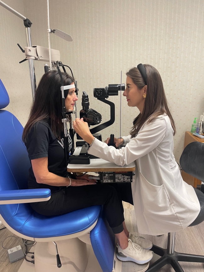 Dr. Marshall performing an eye exam. 