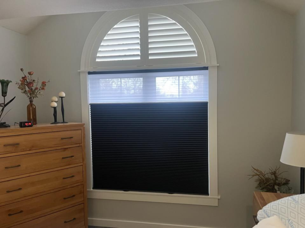 This Sheridan customer chose to go with a Norman North American Specialty Shutter for the arched top and an Enlightened Style Latour Tri-Light for the bottom of their bedroom window.