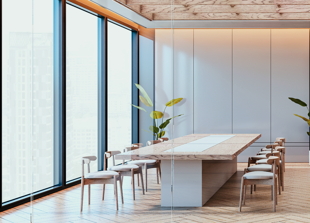 A modern and bright boardroom with light wood features and clean lines.