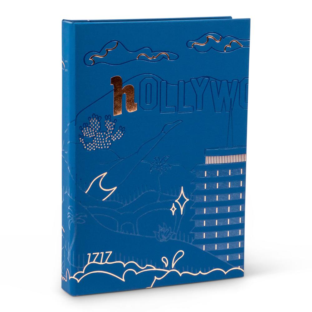 Blue hardcover box with Hollywood illustration and foil detail. Custom packaging by PLC Print.
