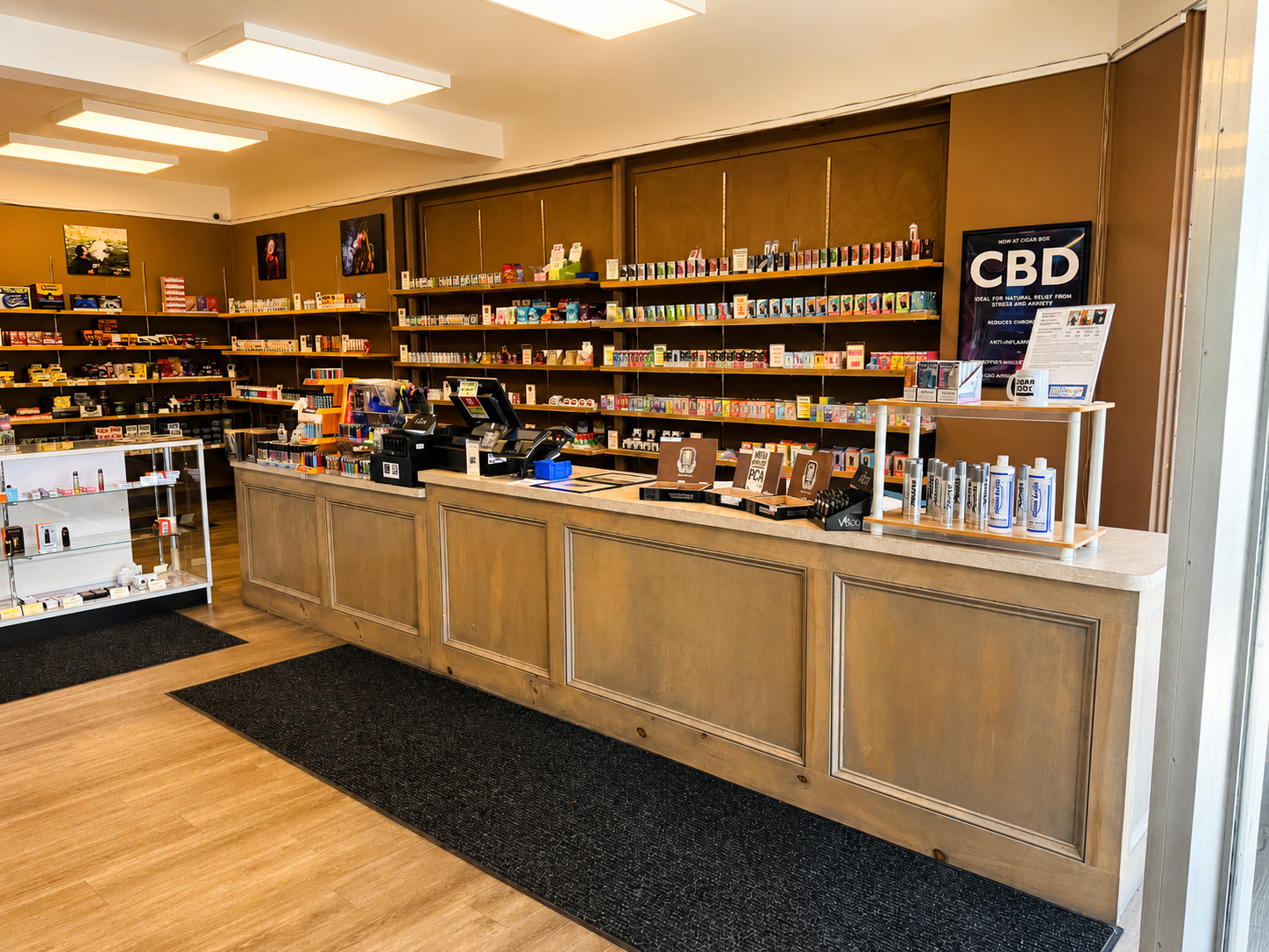 The checkout and retail area at CigarBox Tamaqua features a clean, organized layout with premium cigars, cigar accessories, vaping products, and tobacco essentials. The bright, welcoming interior provides a convenient and enjoyable shopping experience for customers seeking quality products and expert service.