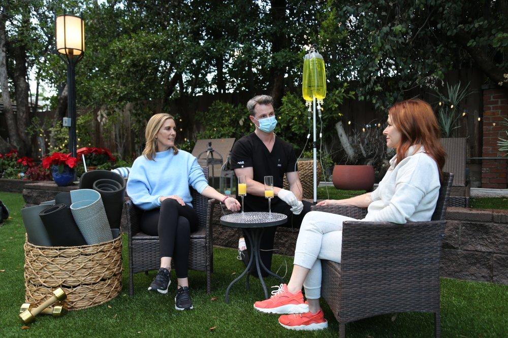 Group receiving mobile IV therapy outdoors in Los Angeles for hydration and wellness.