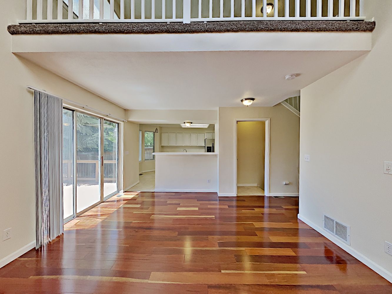 Spacious open floorplan living room with easy access to kitchen at Invitation Homes Denver.