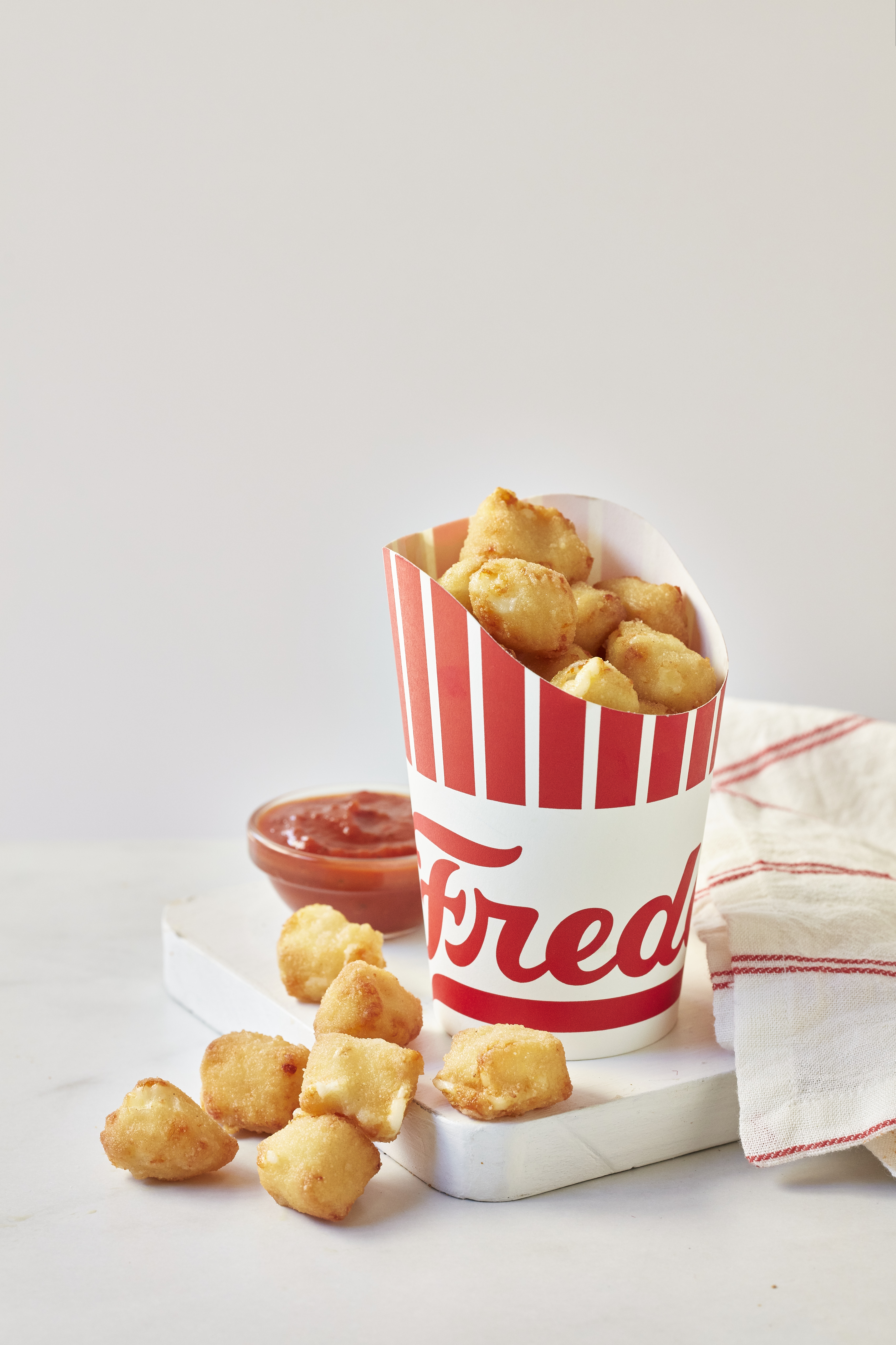 Tater tots in Freddy's cup with ketchup