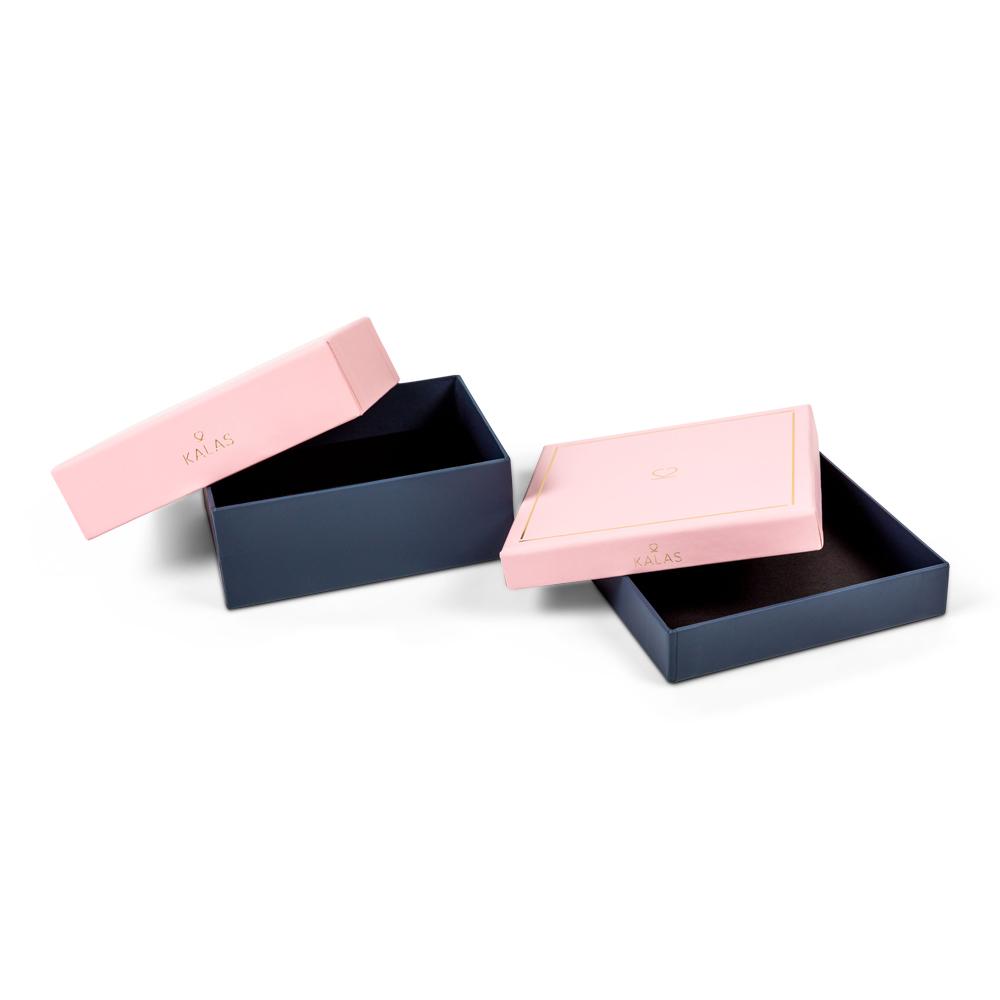 Two-piece rigid boxes in pink and navy. Custom packaging by PLC Print.