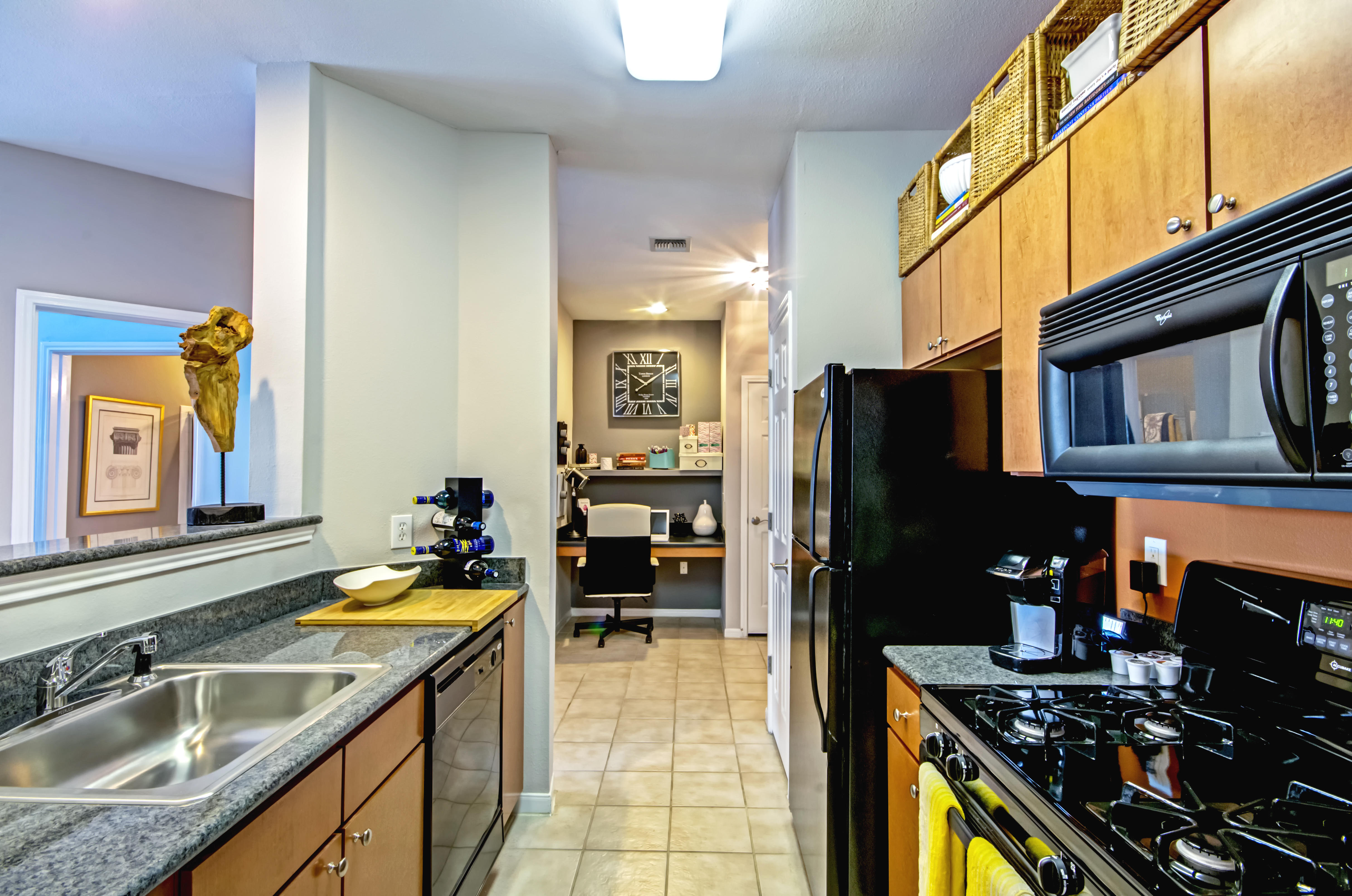 Enjoy cooking with a gas range stovetop in our galley style kitchen