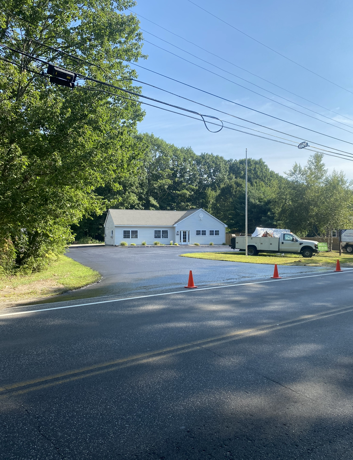 Residential driveway sealcoating, restoring appearance and protecting asphalt for long-lasting durability.
