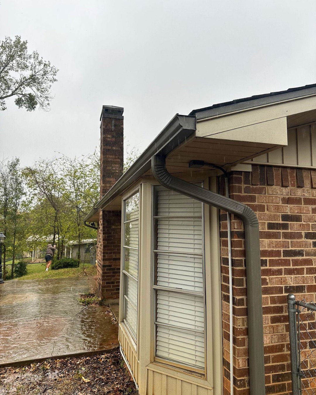 Seamless gutters and downspout on a brick home 