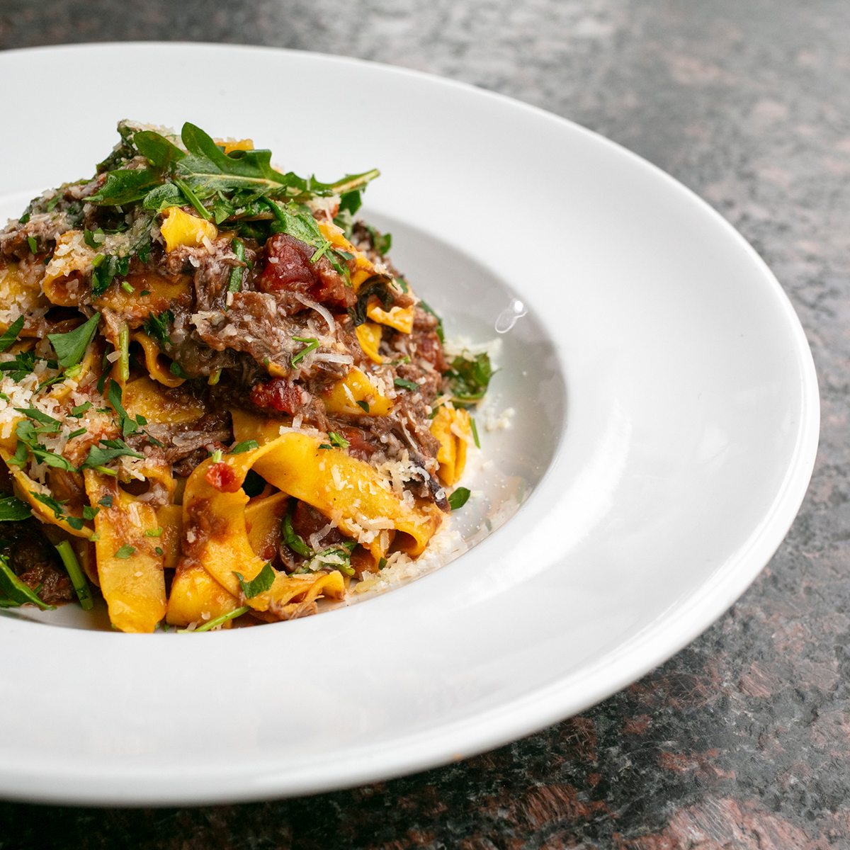 Braised Short Rib Pappardelle | arugula, grana padano, garlic butter, rag&uacute;, pulled short rib