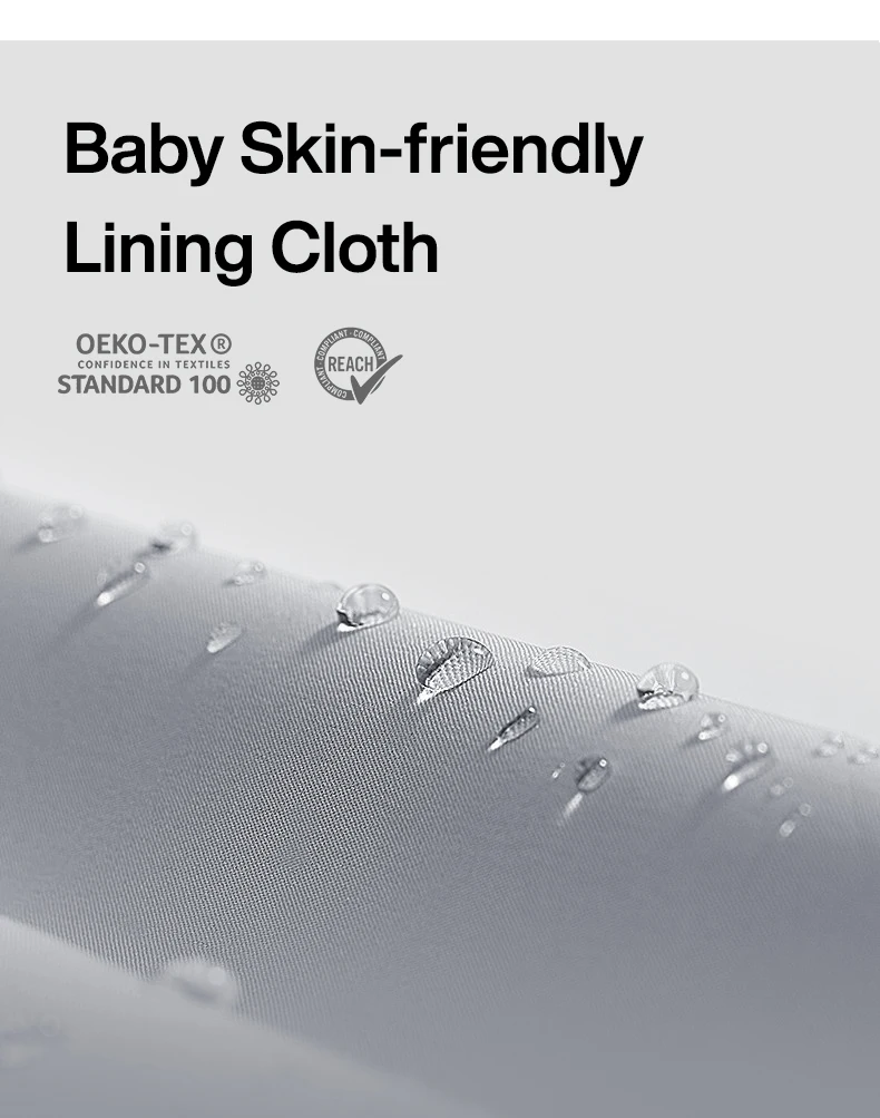 A close-up shot of light gray fabric with water droplets on its surface. The fabric is textured and appears to be waterproof or water-repellent. The image includes text stating "Baby Skin-friendly Lining Cloth" and two certifications: "OEKO-TEX® STANDARD 100" and "REACH COMPLIANT".