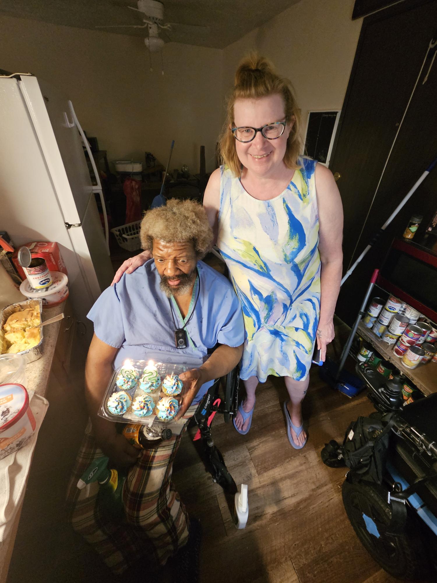 Caregiver supporting an older adult with companionship and daily care at home.