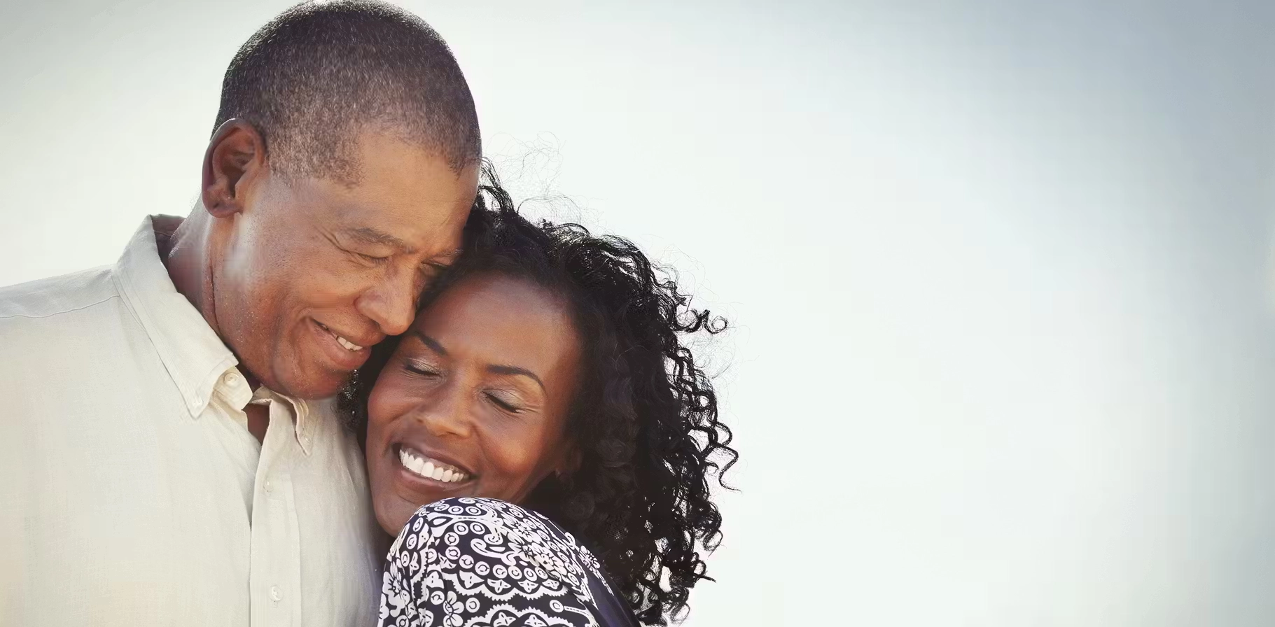 A middle-aged couple getting used to their hearing aids.