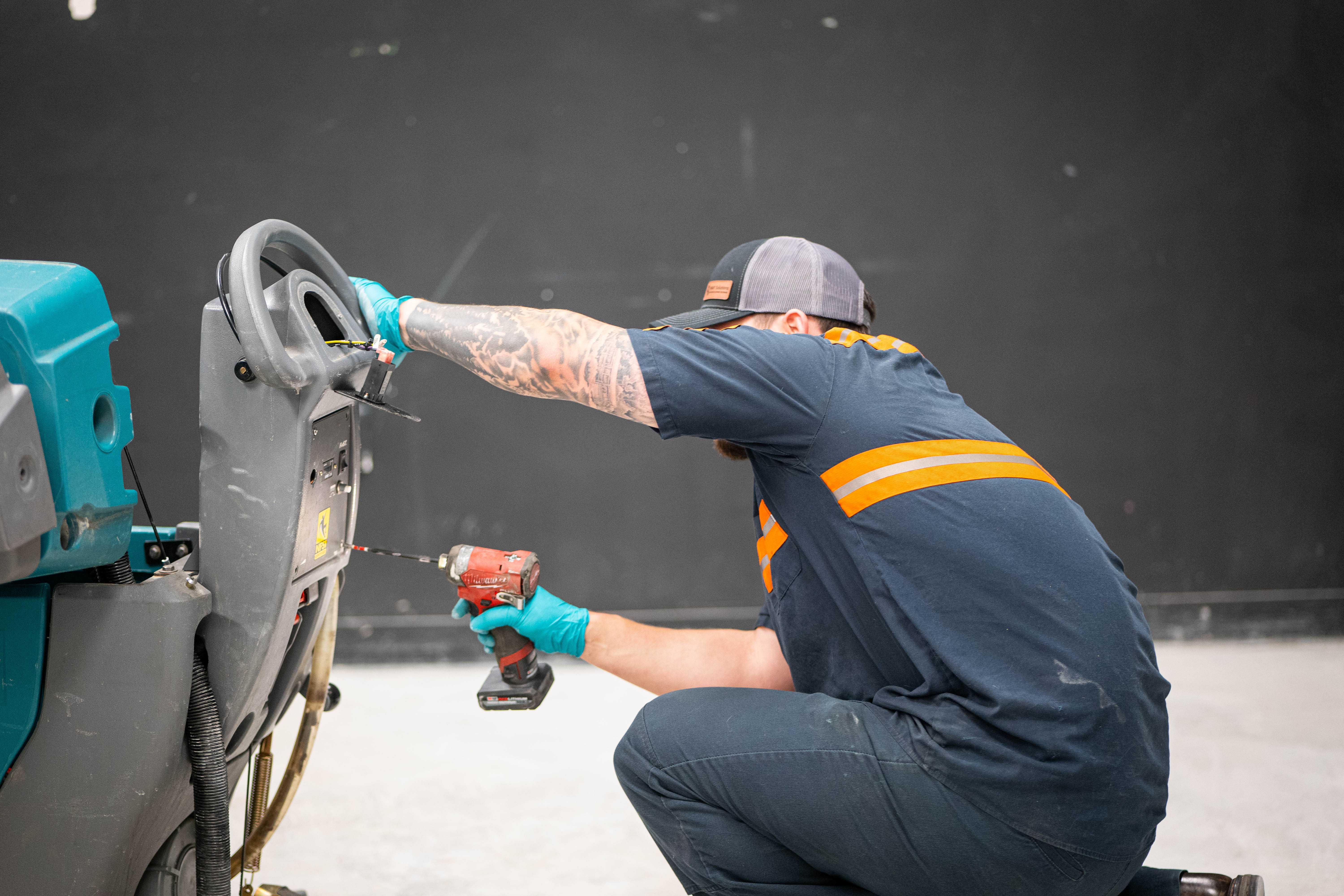 Equipment Model: Tennant T3 FAST Walk-Behind Scrubber
Action: Steering column disassembly and hardware maintenance
Tools Used: Cordless impact driver
Context: Commercial cleaning equipment mechanical repair for retail environments