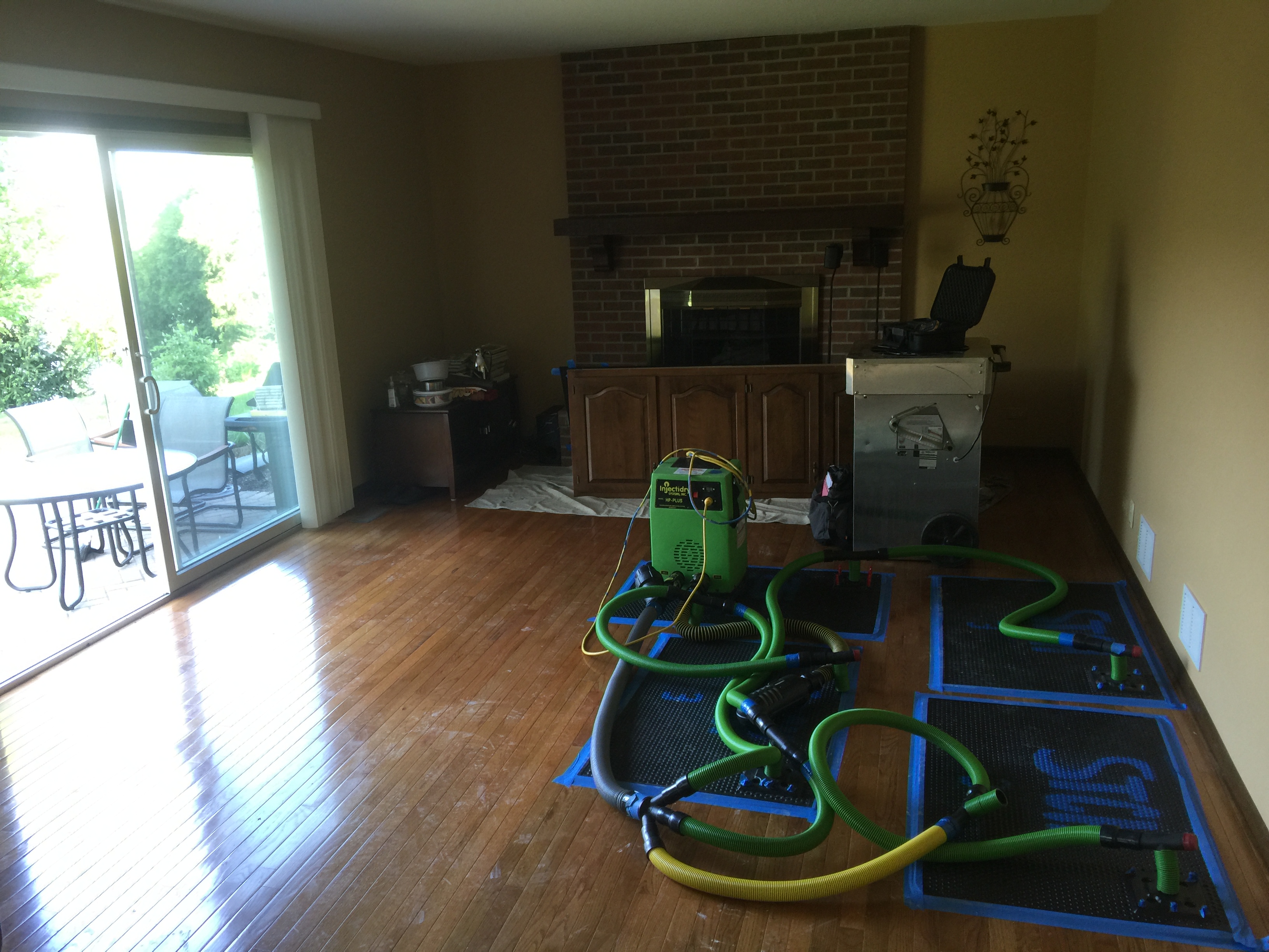 The floor mat system is in place to dry the hardwood floors!