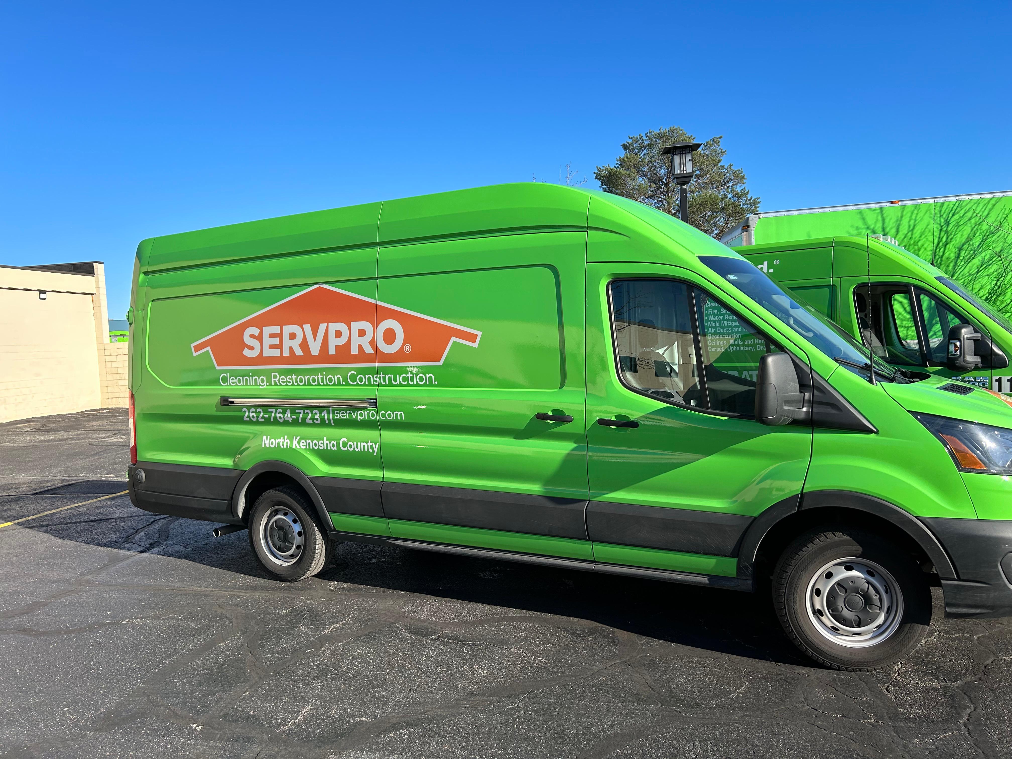 Sde view of a green SERVPRO van
