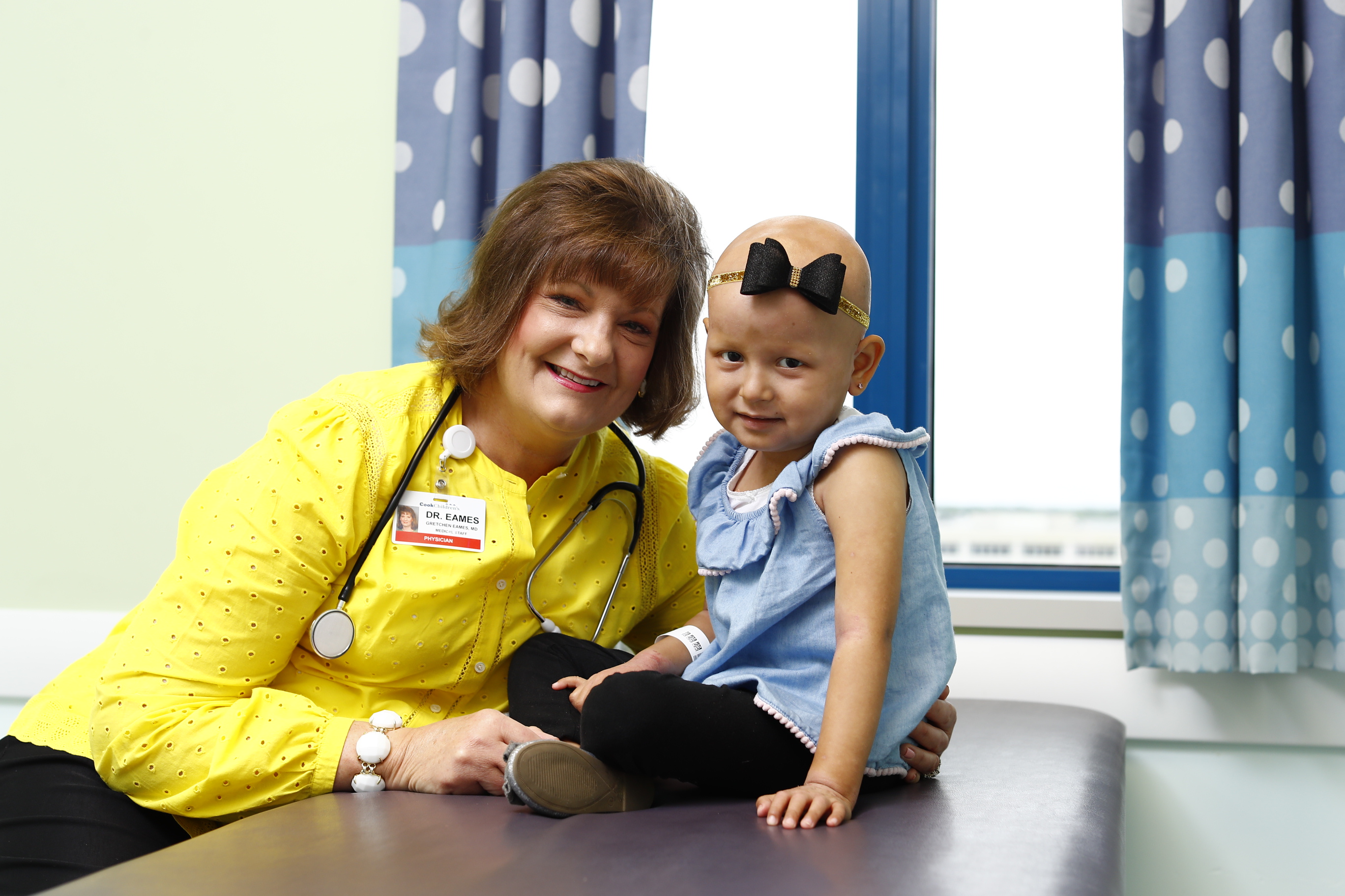 Dr. Eames with a patient in the Cook Children's Hematology and Oncology Clinic