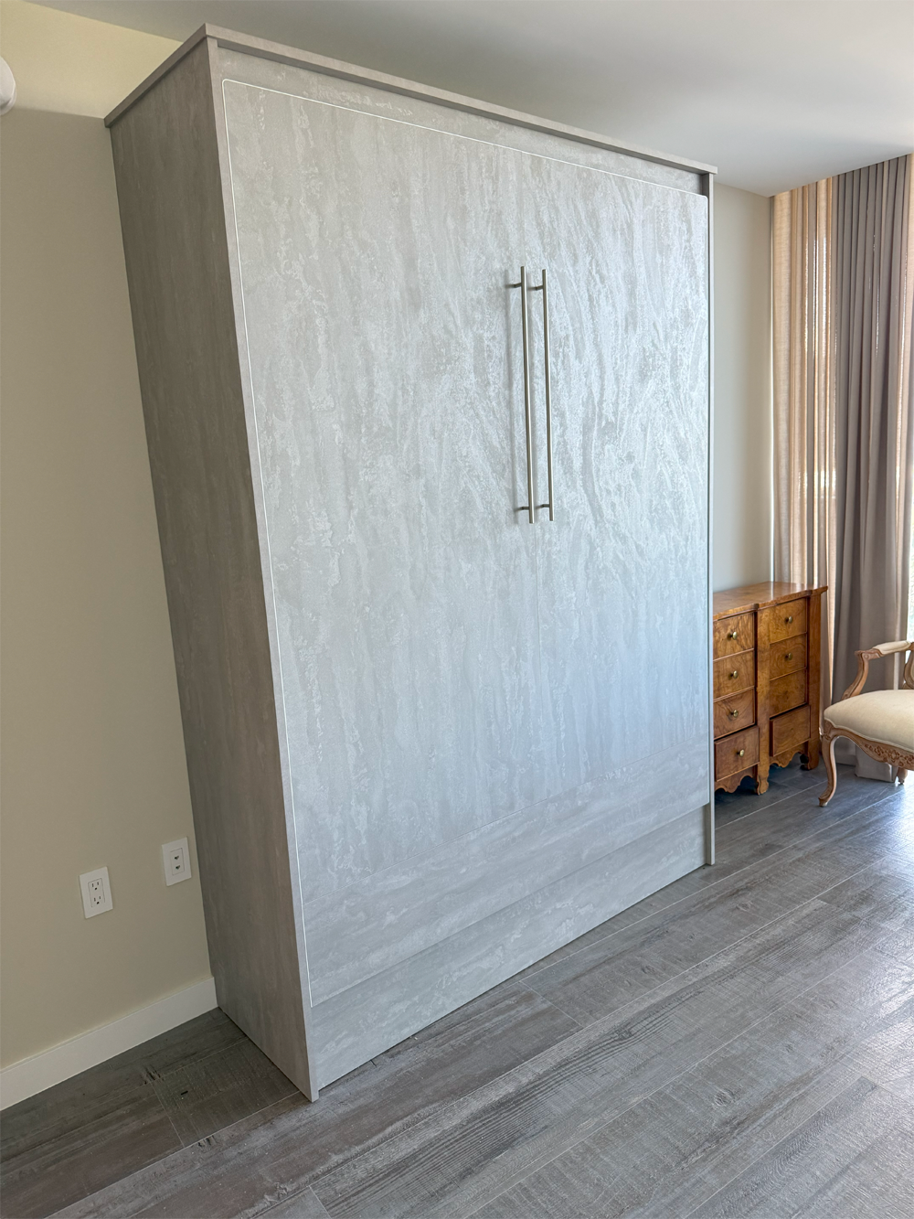 Murphy bed cabinet closed in Concrete Flow textured finish
