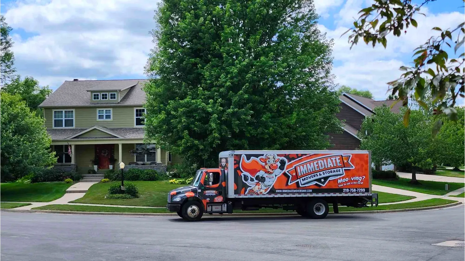 Immediate Movers moving truck at a customers home