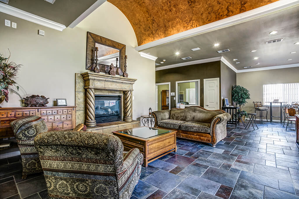 A living room with a fireplace and a couch
