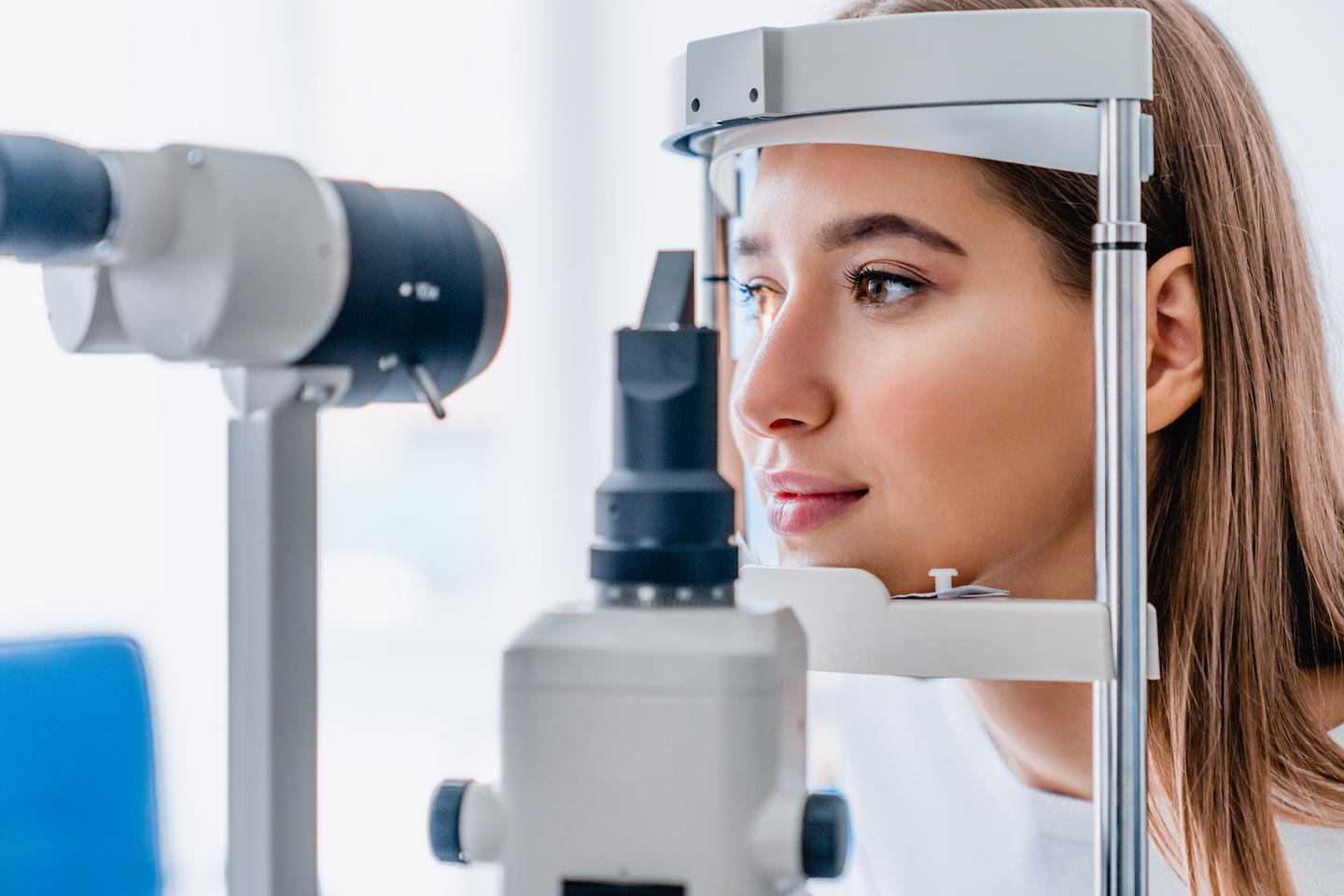 Female patient getting a vision exam.