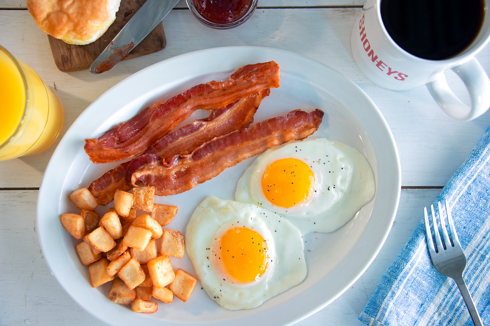 Our All-Star Breakfast includes two freshly-cracked eggs over easy with crispy bacon, breakfast potatoes, and a buttermilk biscuit. Now that's a great way to start your day!