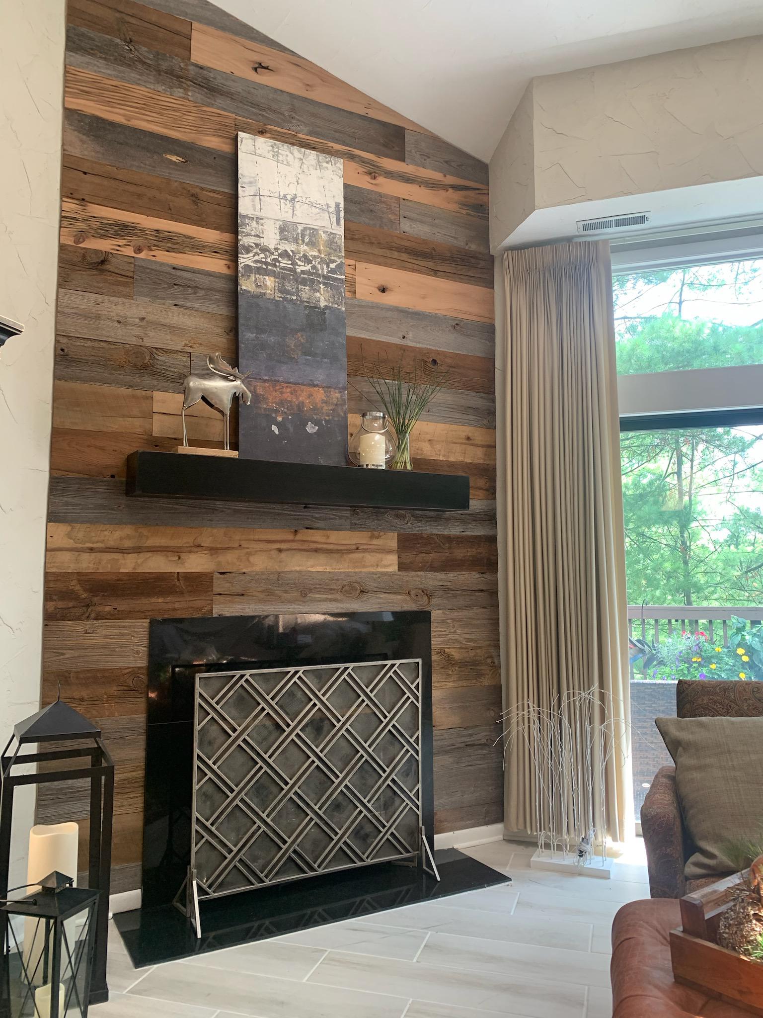 They did a great job picking out their Reclaimed wood for this fireplace wall. Using  a mixed species of barn siding. They tied it together with a black mantle and firebox frame!